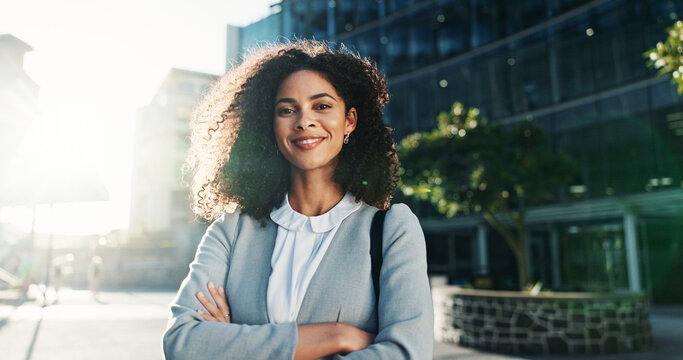 Portrait, smile and woman with arms crossed, city and commuting to work in morning, social worker and road. Outdoor, human services professional and happy person on urban street, travel and employee