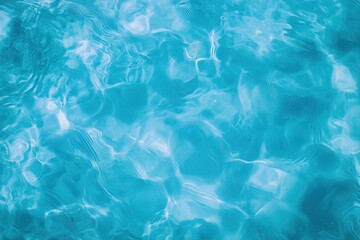 Vibrant turquoise water reflecting sunlight at a serene outdoor pool