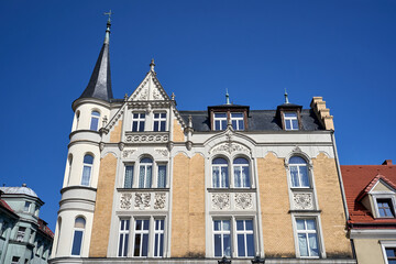 facade of a historic tenement house with a turret in the city of Pszczyna