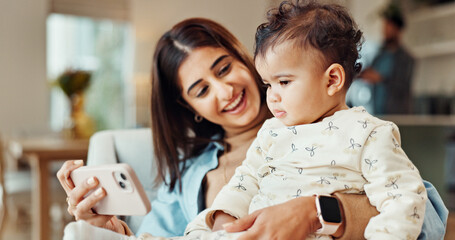 Mom, baby and phone on couch, happy and relax with video, cartoon and streaming in living room. Woman, mother and daughter with smartphone, learning and subscription on sofa in lounge at family house