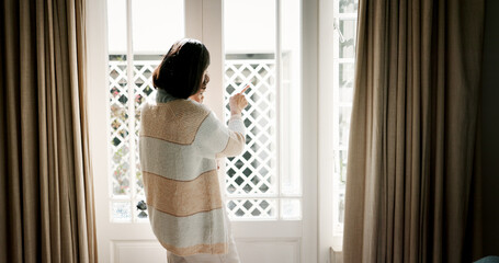 Window, family and mom with child, house and pointing at view, care and parent with baby for scenery. Back, woman and bonding with boy in home, looking or showing neighbourhood to infant in apartment