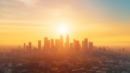 Fototapeta premium Urban Horizon: A city skyline basks in the warm glow of sunrise or sunset, casting a majestic silhouette against a vibrant, hazy sky. 