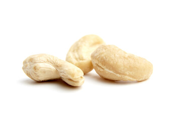 Three raw cashew nuts with smooth, creamy texture arranged on a white background. Ideal for organic, plant-based, or healthy snack themes