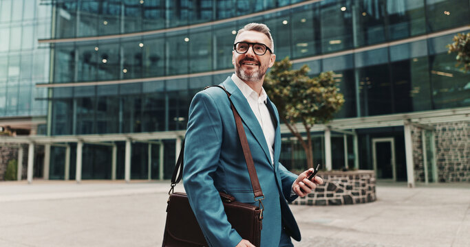 Phone, business man and walking in city for travel with law career, internet or network connection. Happy, male lawyer or online for legal advice, mobile app or thinking of plea deal success outdoor