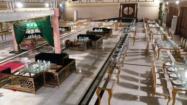 Luxurious Banquet Hall Interior with Elegant Seating and Golden Decor : A beautifully designed banquet hall featuring opulent golden decor, seating arrangement