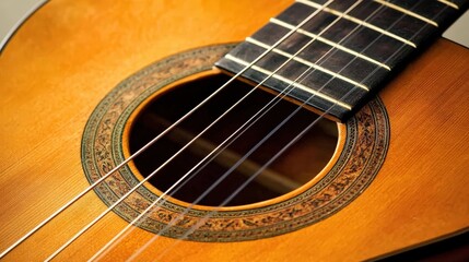 Obraz premium an acoustic guitar with strings vibrating as a musician strums a beautiful melody.