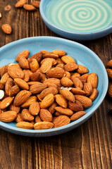 Almond oil with almond seeds.