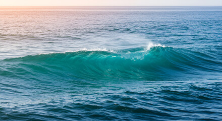 Fototapeta premium Sunlit turquoise ocean waves cresting in the distance, seascape beauty
