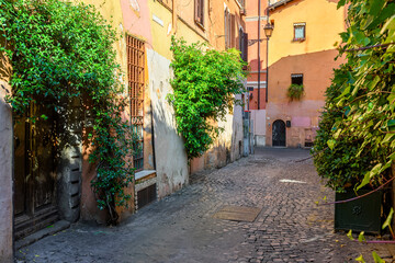Cozy old street in Trastevere in Rome, Italy. Trastevere is rione of Rome, on west bank of Tiber in Rome. Architecture and landmark of Rome