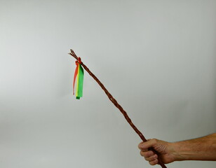 Traditional Czech Easter whip with colored ribbons 
from willow branches in my hand