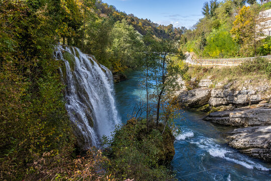 Panoramic photograph of the Rastoke Waterfalls, where the Slunjčica River meets the Korana River, creating a dreamlike landscape. Rastoke, Croatia