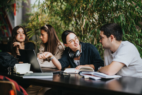 Group of high school friends studying together at a coffee bar, sharing ideas and working on assignments. The setting is cozy and relaxed, fostering creativity and collaboration.