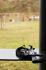 Kalashnikov assault rifle prepared for shooting at the outside shooting range