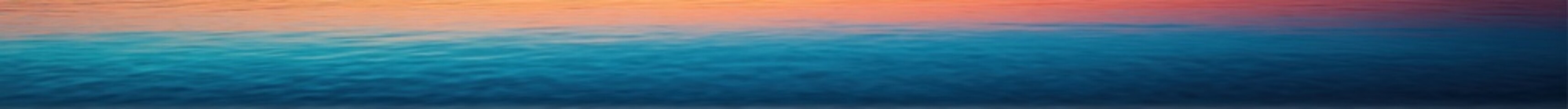 Obraz premium Tranquil gradient of ocean water blending seamlessly with the sky colors