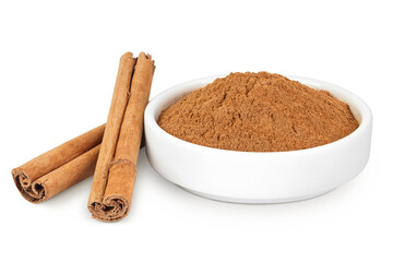 Cinnamon sticks with powder in ceramic bowl isolated on white background with full depth of field
