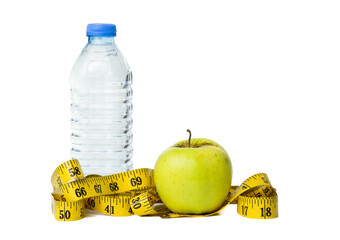 Bottle of water, measuring tape and apple isolated on white background