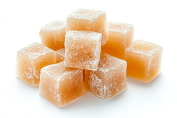 a pile of sugar cubes on a white surface