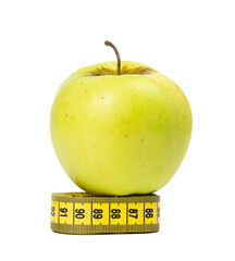 Green apple and measuring tape isolated on white background
