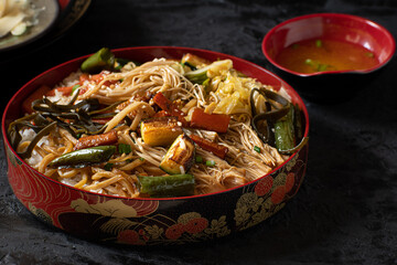Chirashizushi and miso served in traditional Japanese dishes