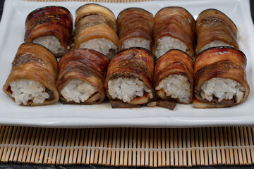 Vegan sushi rice rolled in teriyaki eggplant slices