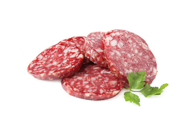 Pieces of delicious dry cured sausage and parsley isolated on white