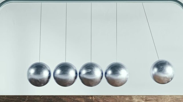 Seamless looped 3d animation of newton's cradle in infinite motion. Metal balls move from side to side transferring kinetic energy. Frontal view, light colored background. Concept of energy, motion