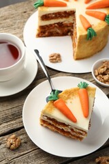Delicious homemade carrot cake served on wooden table