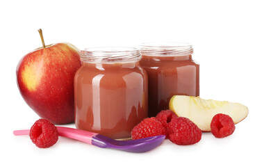 Baby food. Tasty puree in glass jars, fresh apples, raspberries and spoon isolated on white
