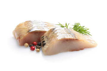Pieces of delicious herring with dill and peppercorns isolated on white