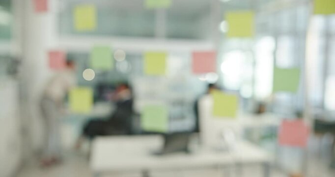 Glass, planning and blur with business people in office for problem solving, idea and meeting. Brainstorming, sticky notes and moodboard with employees in agency for solution, creative and project