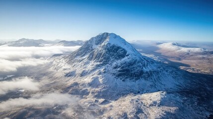 Aerial view of the famous Buachaille Etive Mr mountain in Glencoe, standing tall against the highland sky