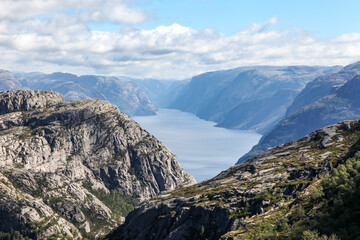 Mountains in Norway hiking trail to Preikestolen, see lyse fjord the sky is overcast