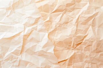 Fototapeta premium Close-up of crumpled beige paper texture.