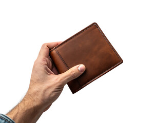 A hand holding a brown leather wallet against a black background in a studio lighting setup 