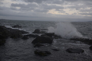 waves crashing on rocks