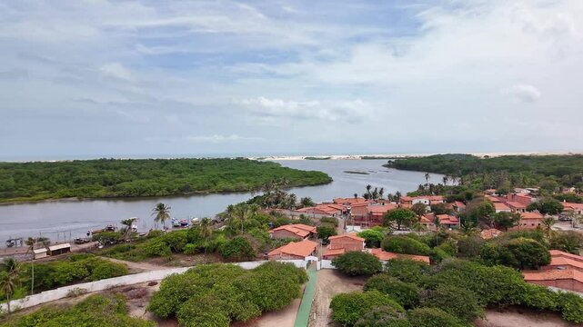 Village of Mandacaru, Barreirinhas, Maranhao, Brazil. Photo taken from the top of the Mandacaru lighthouse, overlooking the Preguicas River, and the Atlantic Ocean in the background.