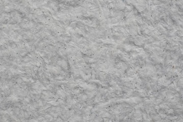 Obraz premium Gray handmade paper texture with little dark speckles creating a beautiful background