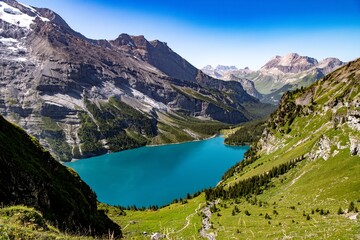 Breathtaking views of Lake Oeschinen and the mountains of the Bernese Oberland.
Oeschinen Lake is a lake in the Bernese Oberland, Switzerland, 4 kilometres east of Kandersteg in the Oeschinen valley. 