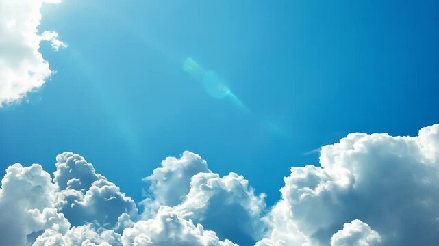 Bright clouds fill a clear blue sky over a peaceful landscape during midday, creating a serene and uplifting atmosphere for all to enjoy