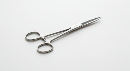 Surgical precision: A close-up of medical scissors on a stark white backdrop