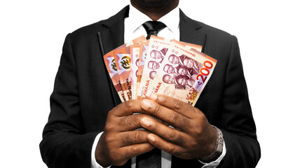 Black African Business man wearing suit and tie holding Ghanaian cedi notes over transparent background. front view