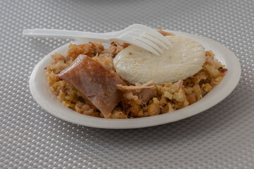 Typical Tolima suckling pig with rice, a typical Colombian dish