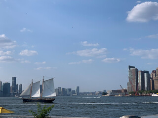 An ancient manpowered sailing ship clashes with the modern skylines of New York City.
