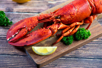 Red lobster on wooden cutting board 
