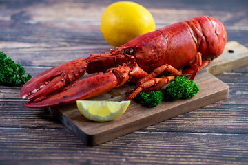 Red lobster on wooden cutting board 