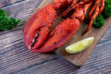 Red lobster on wooden cutting board 