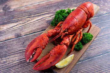 Red lobster on wooden cutting board 