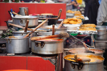 Pots of food for sale at the Cholula market in Puebla, Mexico.