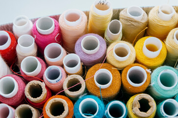Close-up of colourful sewing thread spools