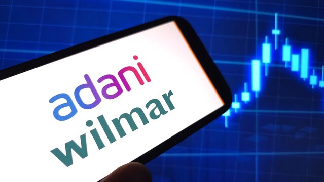 Konskie, Poland - March 26, 2025: Adani Wilmar company logo displayed on mobile phone